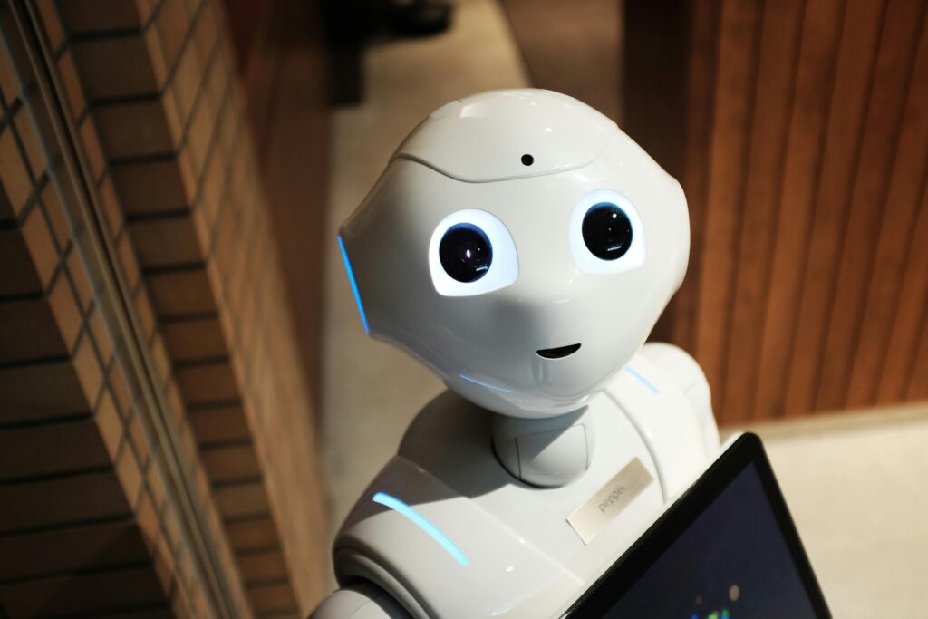 AI receptionist assisting a patient at a clinic front desk, illustrating how AI receptionists are changing clinics.- automotive answering service