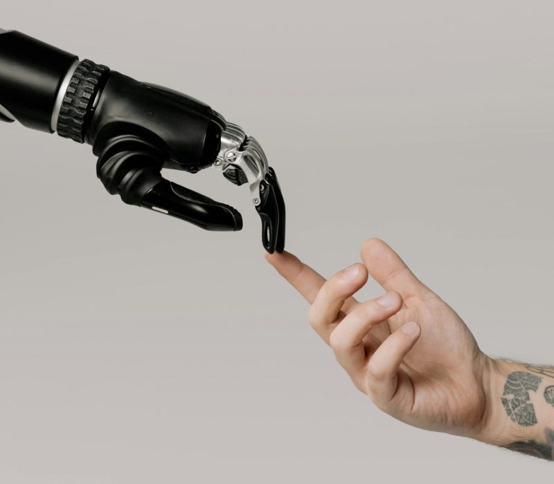 robot holding human hand-automotive answering service
